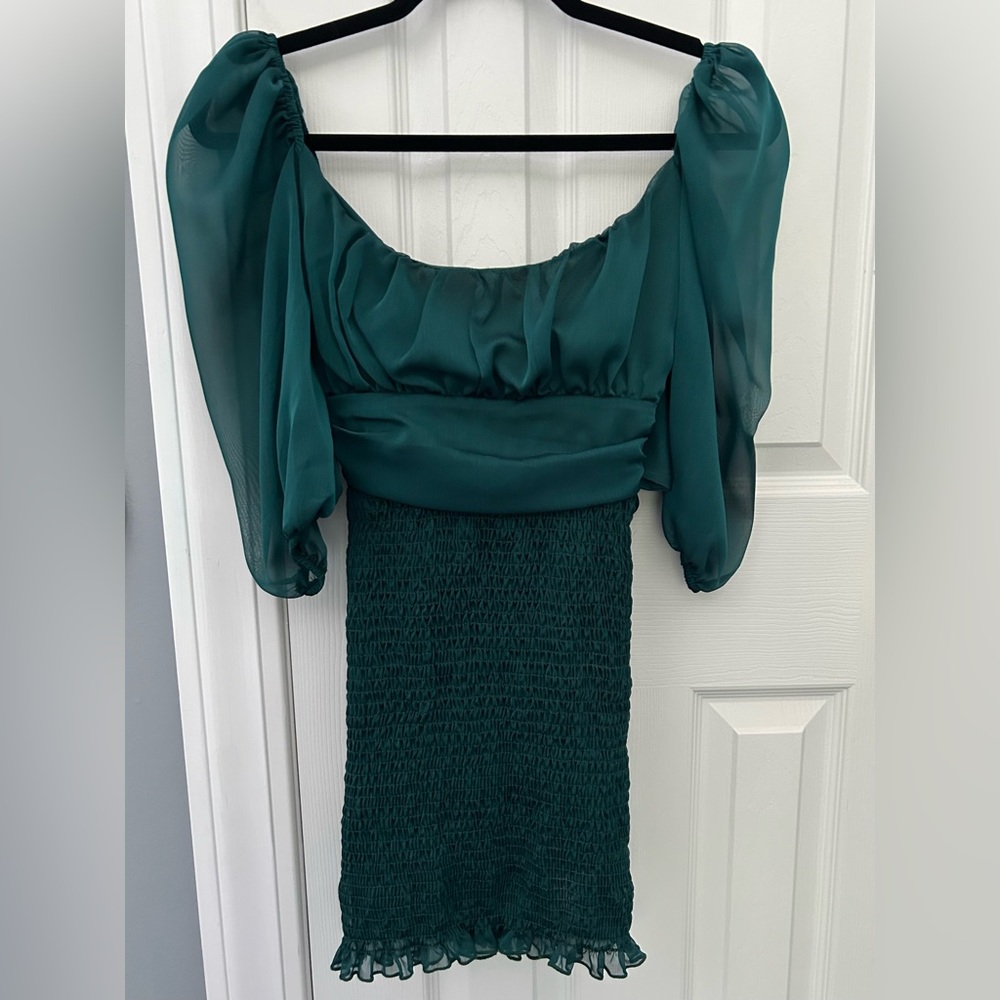 dark teal, puffy sleeved, chiffon bottom dress with a tie back